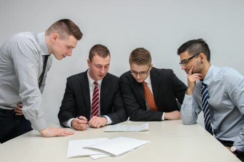 Colleagues reviewing financial documents together during an internal controls walkthrough