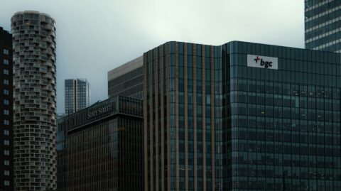 Modern glass office towers in a financial district, illustrating corporate valuation and business acquisitions